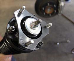 Remove the lower strut mount nut and bolt.