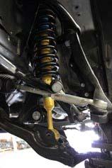 Raise the lower control arm and install the lower