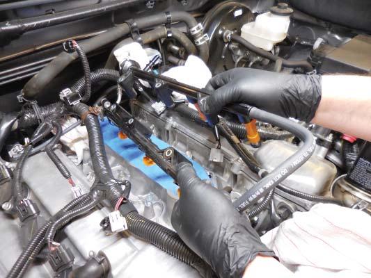 53. Clean the injector insulators and install them onto the new injectors.