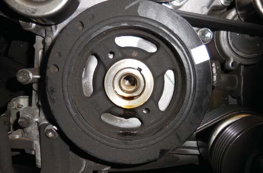 Observe the location of the keyway in the OEM pulley (shown with an arrow).