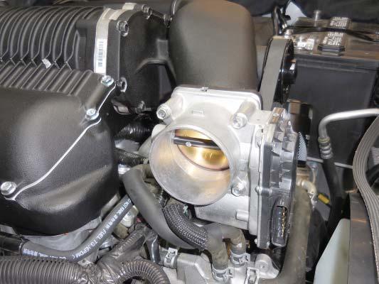 Install the throttle body to the supercharger housing.