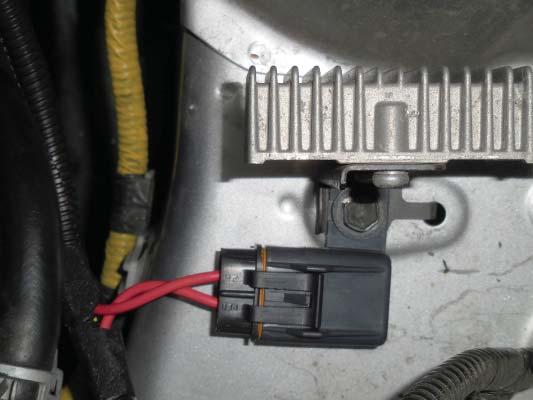 Using the supplied M6x20 bolt and hex nut, mount the intercooler relay harness on the rear of the radiator support