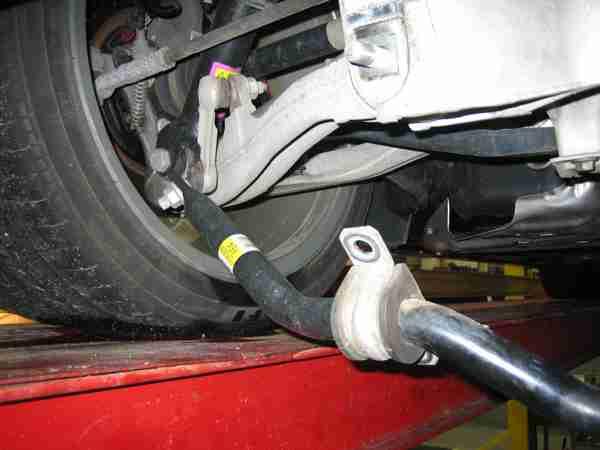 Factory Exhaust System Removal: INSTALLATION INSTRUCTIONS / CAT-BACK EXHAUST SYSTEM 1.
