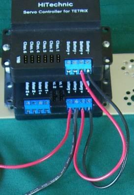 4. Attach the other end of each wire to the battery terminals of the servo controller