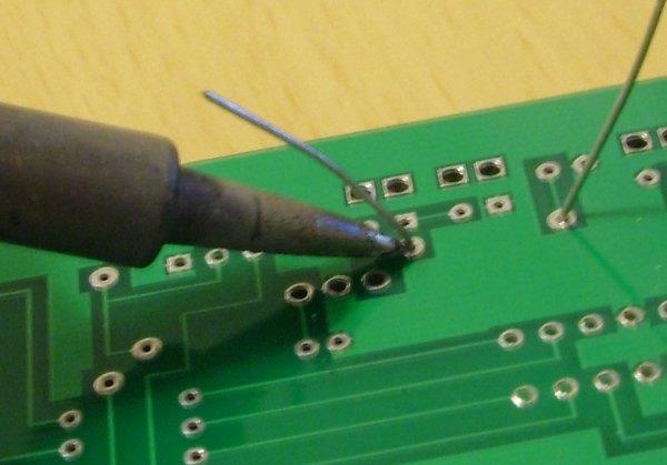 Apply the tip of thin solder to the soldering iron tip, pad, and lead.