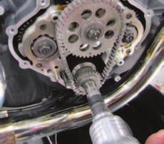 7 11 Dan removes the pinion sprocket and its woodruff key, and the center intake camshaft