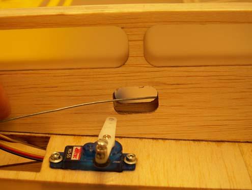 Use a hobby knife to remove the covering from the opening on the right