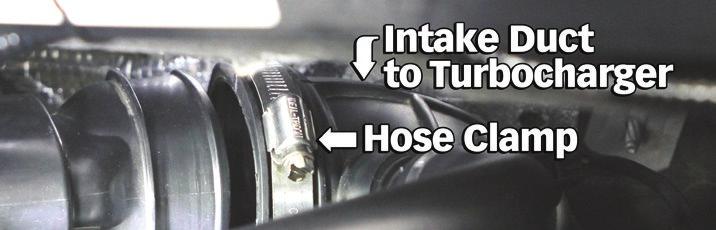 bottom housing. 7. Install the new Banks Intake Tube into the compressor inlet duct hose (oval end).