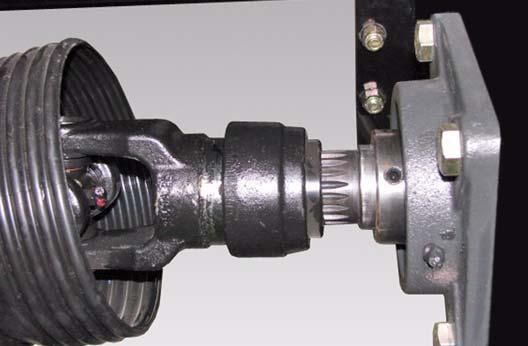 Apply two - three pumps of grease to the cross and bearings (Item ) [Figure ] on the PTO driveline.