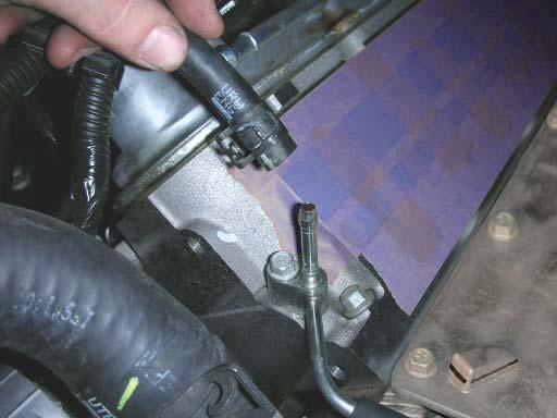 49. Remove the coolant hose from the vent pipe. Note: Some fl uid may leak from the pipe onto the hose. 50.