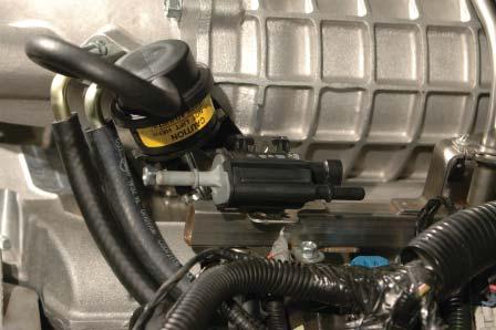 For 07-08 vehicles continue on here; take the front EVAP hose from the stock manifold and carefully cut out