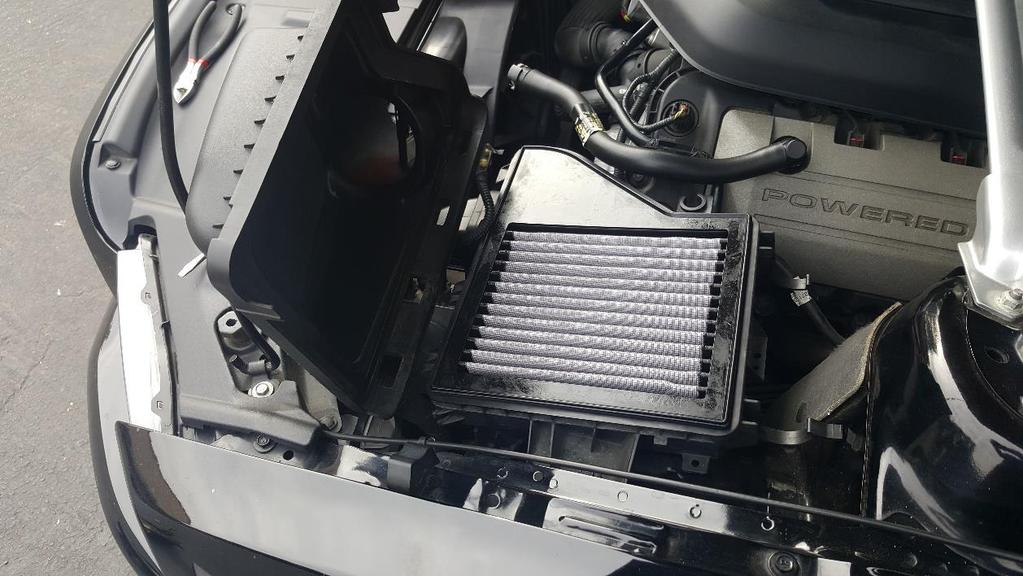 c) Once the Filter compartment is clean, install the AEM Dry Air Filter.
