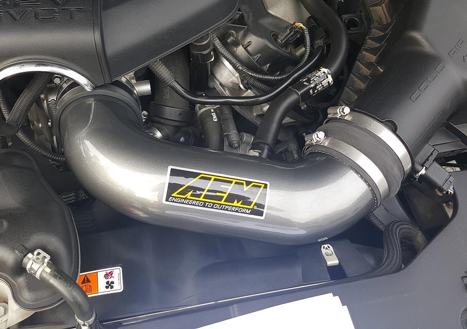 c) Gently install the AEM Aluminum intake tube being careful not to scratch it since it is anodized