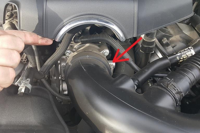 e) Now the engine cover will be loose and you can move it left to the side and out of the way.
