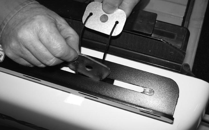 Hold cord while doing this to support clamp and alignment plates throughout the following steps.