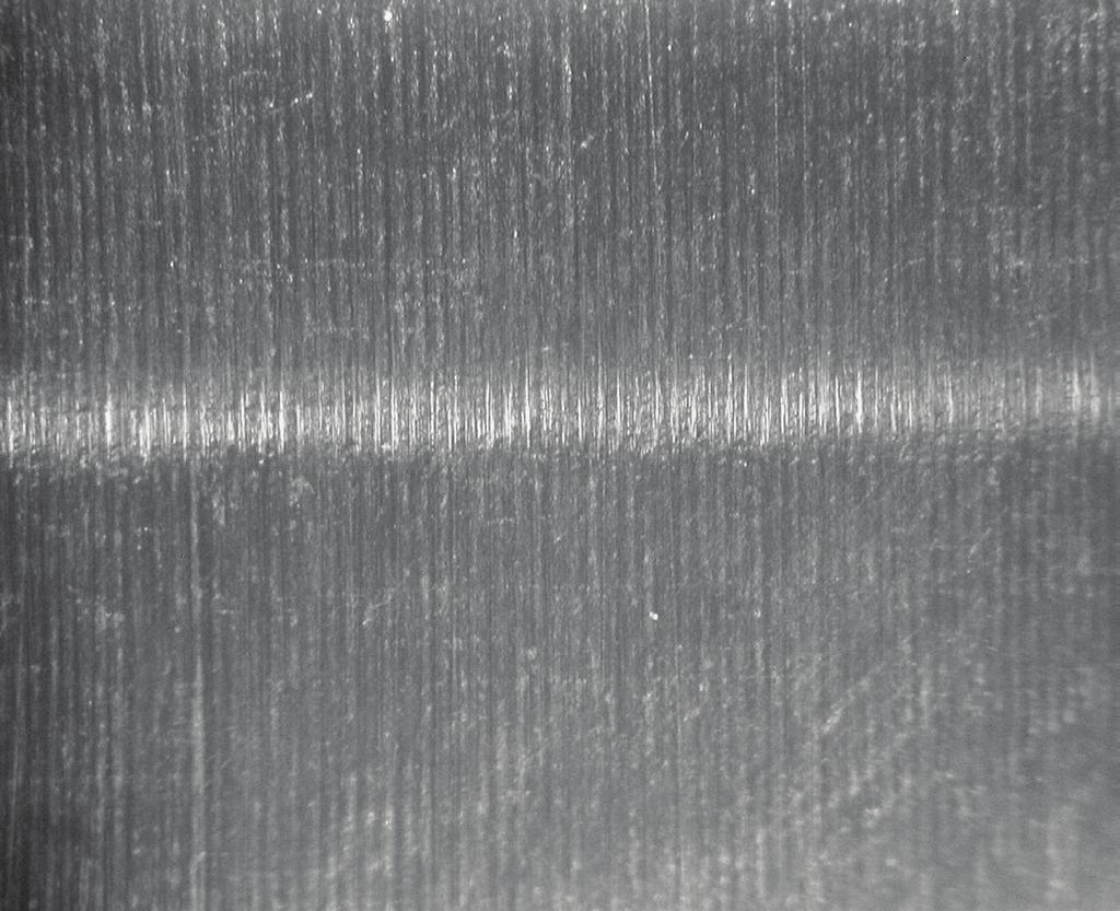 Figure 2 machined surface (100 X magnification) Figure 3 peened surface (100 X magnification) Experimental Methods A seal shaft is shot peened after machining to create isotropic micro-dimples.