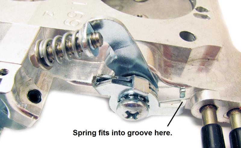 It is advisable to keep the long straight portion of the spring unhooked and after the outer bracket is secured