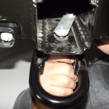 Use a 15 mm socket to remove the two bolts per side holding the tow hook in place. Figure 3 E.