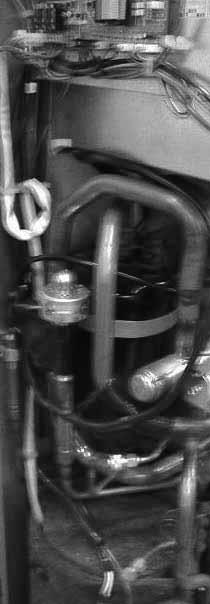 Locate the heater around the compressor and close with the spring according to Figure 1. 4. Route the wires into the cable holders as per Figure 2.