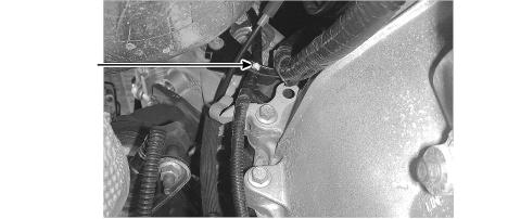 To improve access to the brake booster vacuum hose, position the fuel lines and transmission wiring harness on top of