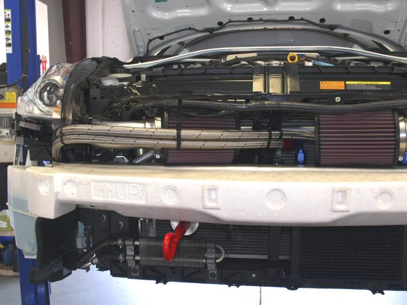 The image below shows that the lines are routed in FRONT of the Passenger Side STILLEN GEN III Intake Filters.