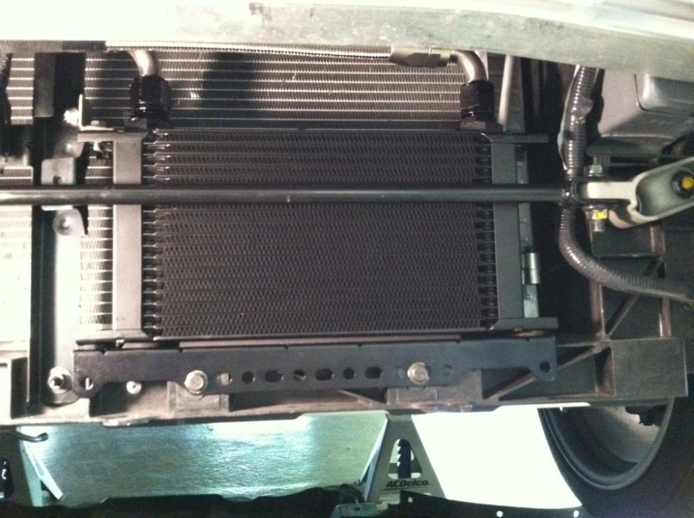 Please note: In order to retain the factory NISMO Chassis Dampener, the Oil Cooler Bracket and Core must be oriented so that the oil cooler core is positioned as close to the Radiator / A/C Condenser