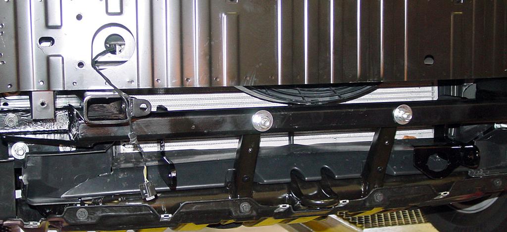 Once the fascia and grille are installed, insert the front braces into the receiver braces and pin using ½" draw pins and 3/16" spring pins as shown (Fig.T).