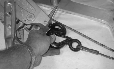 Figure 3-37. Attach the end hook to the eye on the hoist. 7. Engage the ratchet switch.
