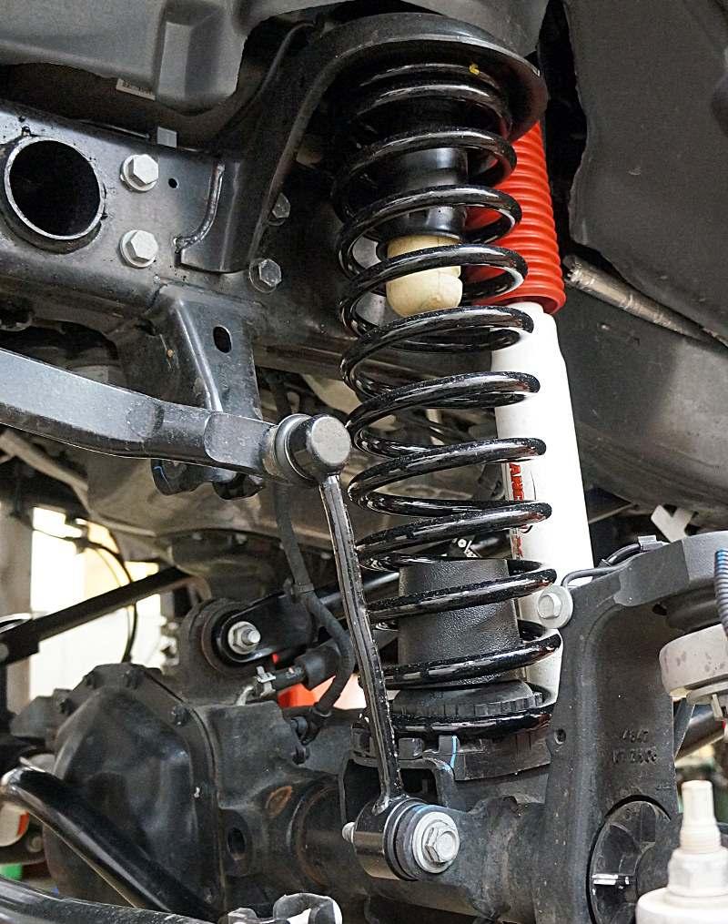 9) Remove bolt and separate the brake hose brackets from the axle. 10) Disconnect any vent hoses. 11) Disconnect any electrical wiring from the axle by sliding out the plug lock and pulling plug out.
