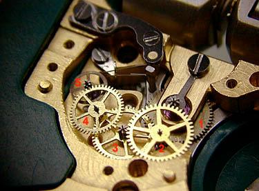movements. The gear train of the Accutron resembles that of a high-grade mechanical movement (right).