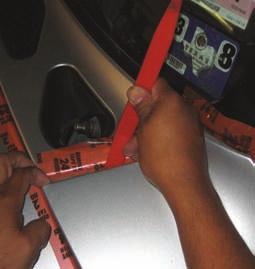 Open the hood and remove the six plastic push-in fasteners using a