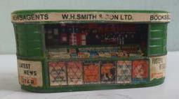 192 Mastermodels 00-scale cast Accessories Mastermodels No. 14 Bookstall, grass green, with name panel 'W.H.Smith & Son'. With back-drop card and surrounding advertisements.