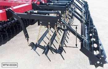 24. Adjust the height of the harrow sections. Note: Make sure the chains are not twisted when inserting into the slot. a. Remove the locking bar retainer clip. d. Replace the locking bar and clip.