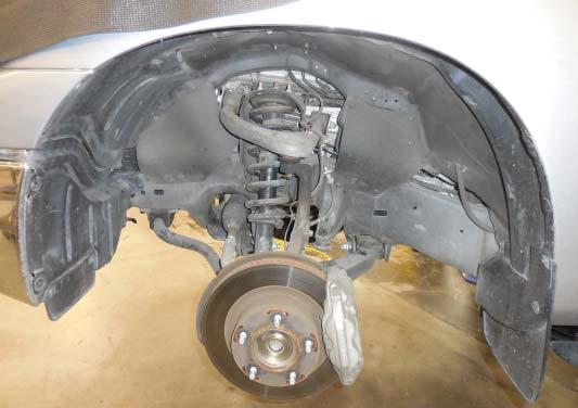 41. With the front left wheel removed you will be able to remove the panel shown with the ar- row for access to