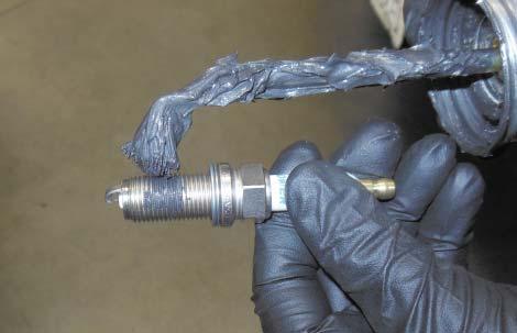 Place some anti-seize grease on the pro- vided spark plug threads (Plug Gap:.