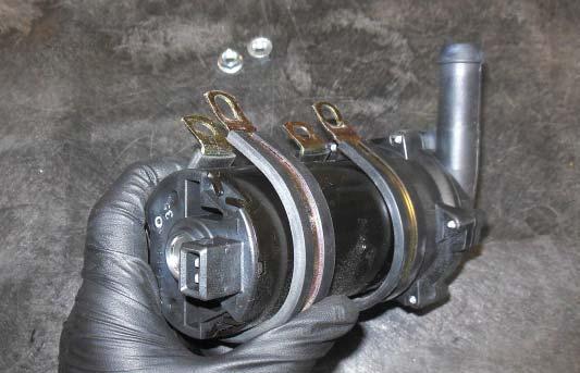 193. Gather the two Adel clamps and install them on the intercooler pump as shown.