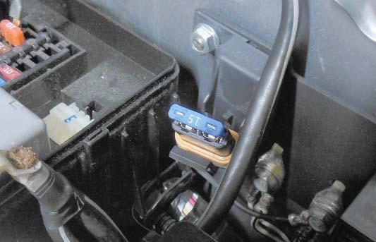 Insert the 15 amp fuse into the fuse holder that was installed on the left fender wall.