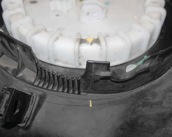 Align tab on fuel pump module with the notch in the tank (shown with an