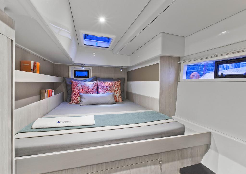 The choice of a three cabin layout features a master cabin in the starboard hull with a walk around queen sized bed.