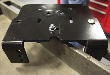 Set the assembly onto the lower bracket main plate (A) making sure the lower bracket cup (B) is on the flanged side