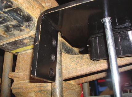 ATTACHING THE LOWER BRACKET TO THE AXLE 1. Push the lower bracket up against the stock U-bolts so that the legs of the lower bracket are locked into position around the stock U-bolts (Fig. D.43).