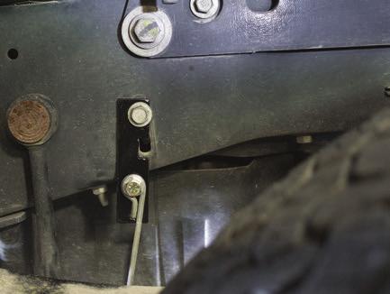Emergency brake cable primary bracket (YY) installs in the forward location on the driver side frame rail (Fig. D.52).