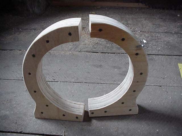 The stator (that part which will eventually hold the coils of wire) is built up of 3/4" plywood. The inner circle has radius of 5", which leaves room for coils between it, and the armature.