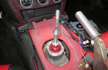 Take the shifter assembly and gently guide it straight down into the transmission.