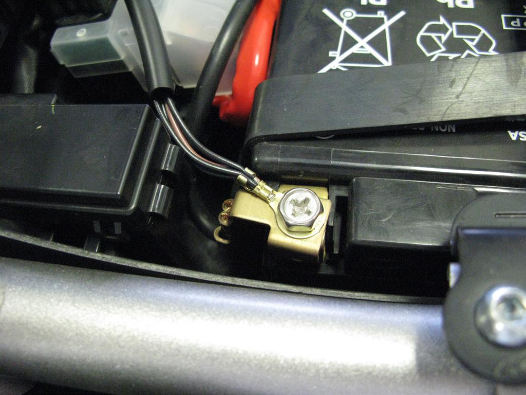 Locate the factory tail light connector, which can be found on the left hand side of the bike in the tail section near