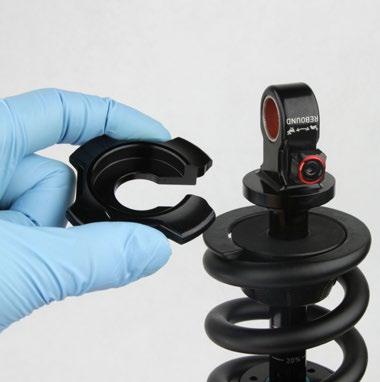 Ensure that there is no vertical play between the coil spring and the retainer by
