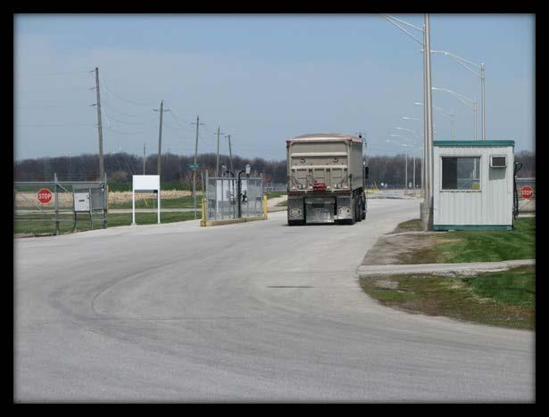 As the truck approaches the Exit gate on the right, the gate will automatically open, allowing the driver to leave the site.