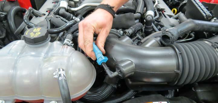 Remove the additional brake aspirator hose from the
