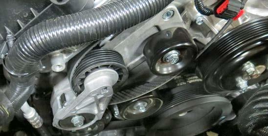 Remove the OEM coil covers on each valve cover to access the ignition coils and spark plugs.
