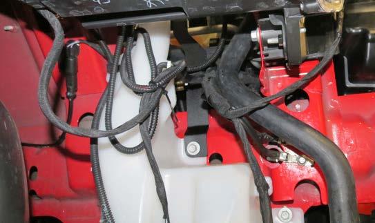 102. Attach the surge tank bracket to the surge tank using two (2) M6 x 10mm bolts